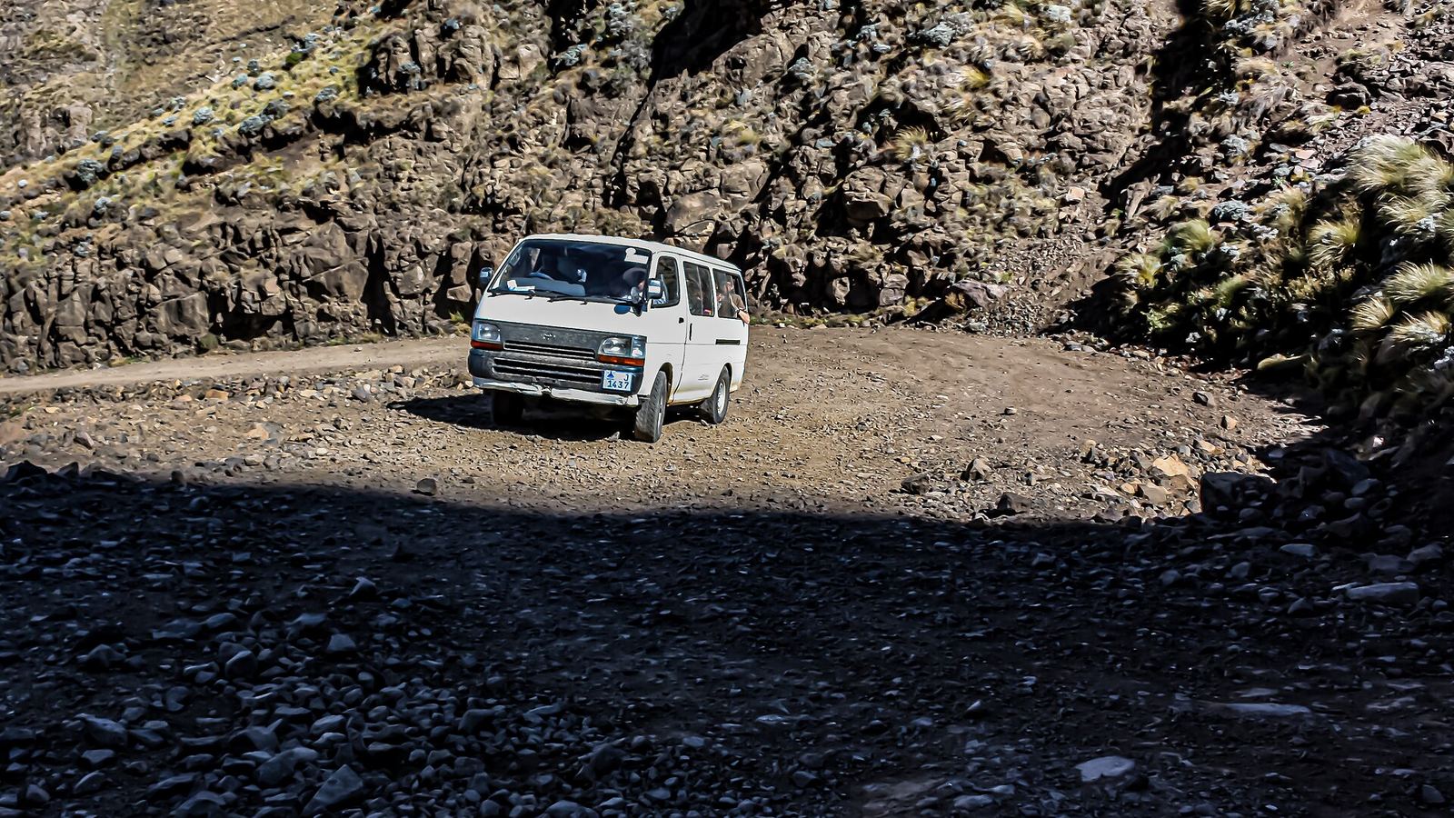Minibus taxi on a rocky mountain track on Route A3 towards Katse