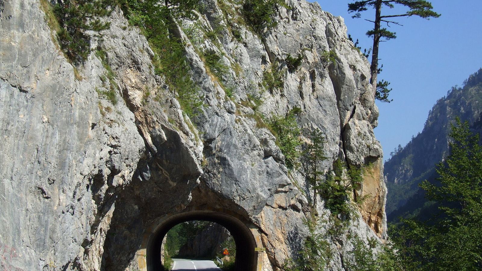 Road No. 4 through a rock tunnel in the Tara River Canyon