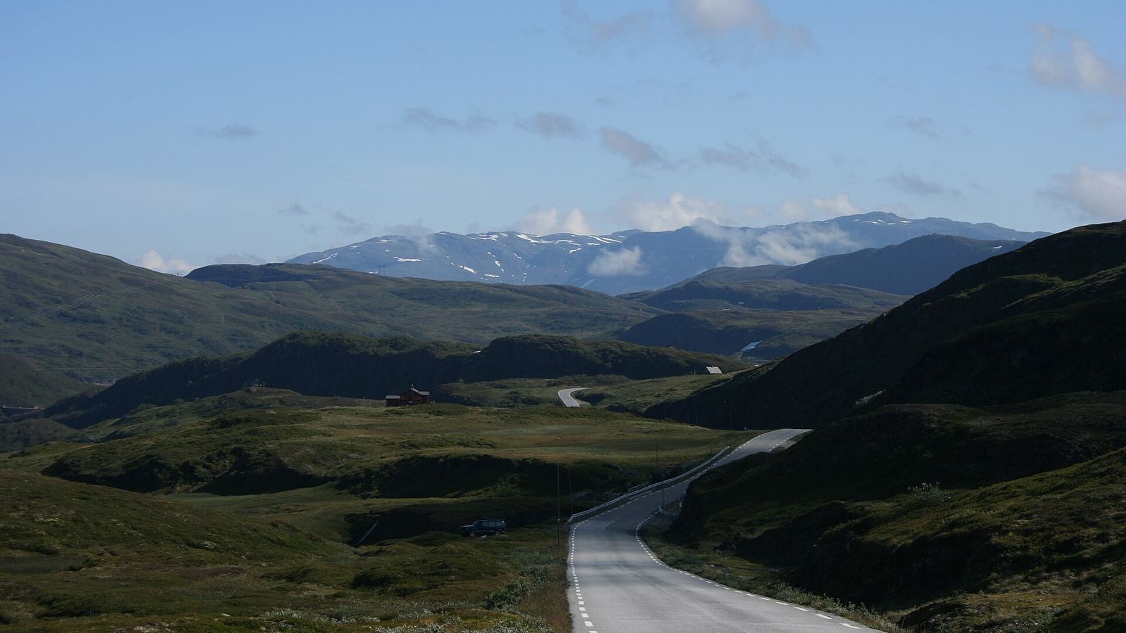 Rv 13 mountain road across Vikafjellet, Sogn og Fjordane, with snow-dusted peaks beyond