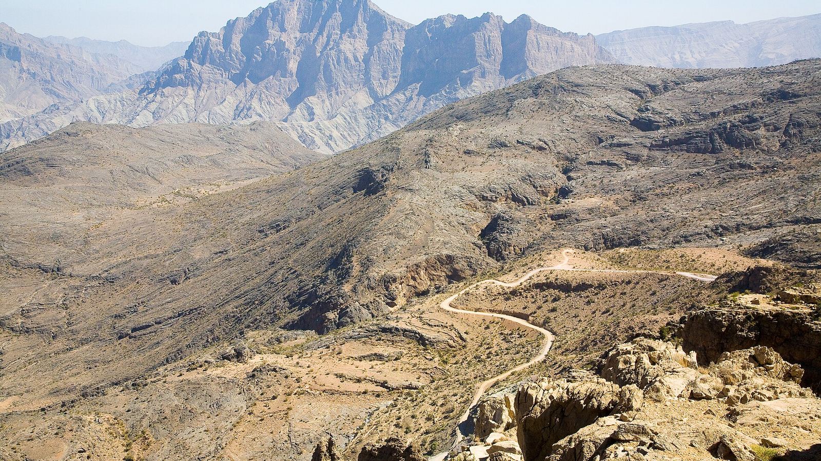 Switchback mountain road through the Al Hajar Mountains near Nizwa, Oman