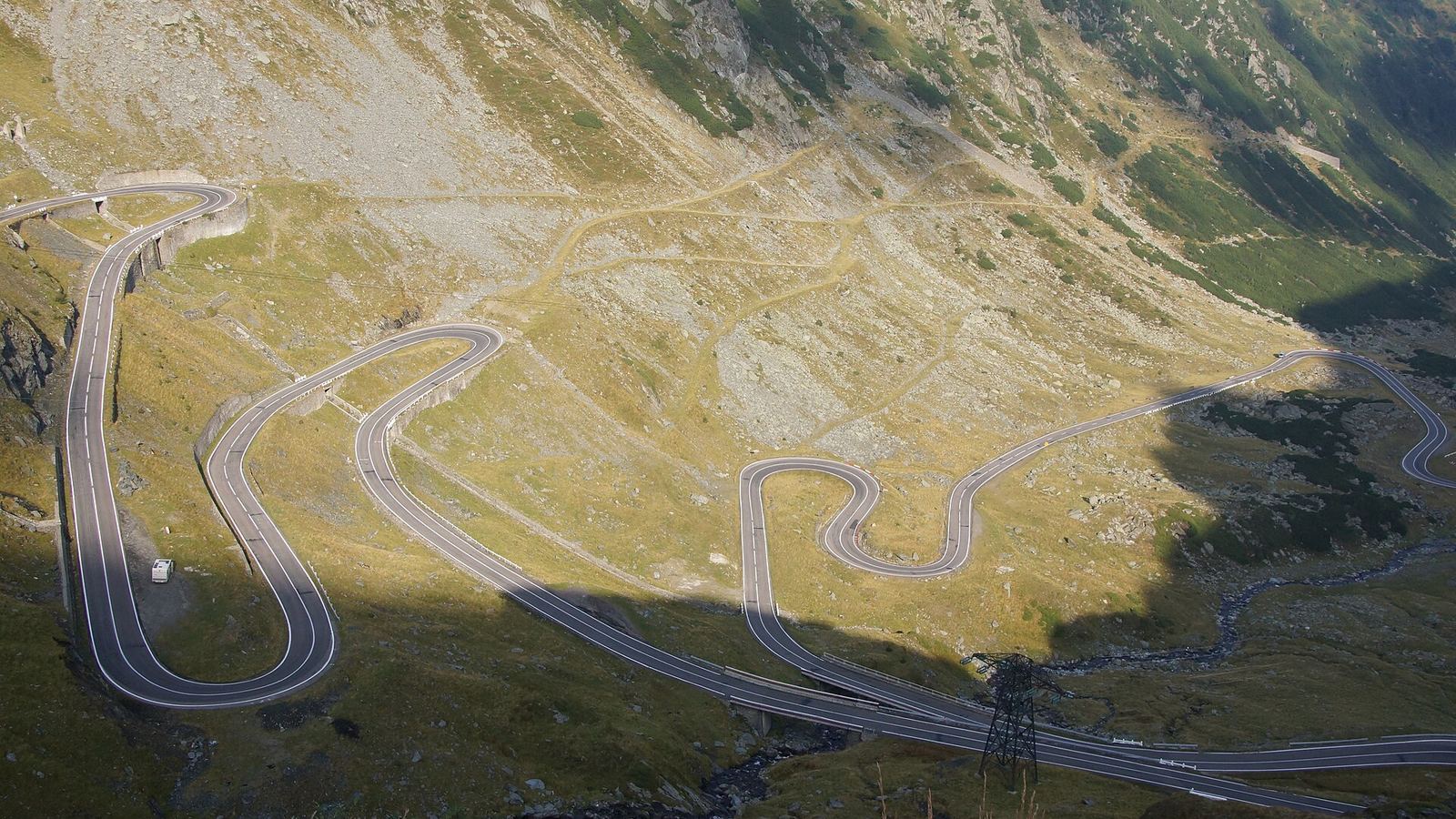 Hairpin bends of the Transfăgărășan road seen from a viewpoint above the valley, Carpathians