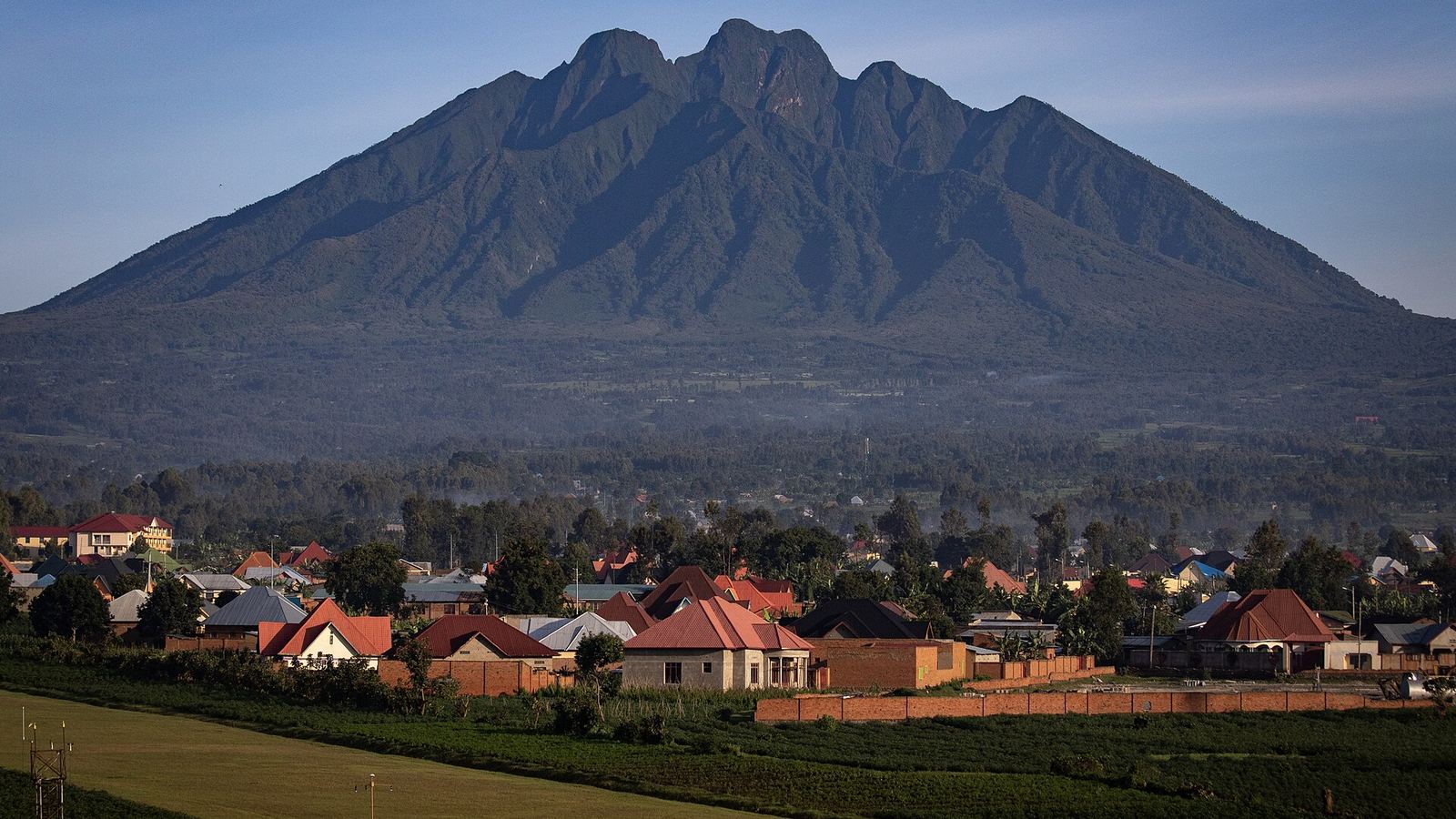 Mount Sabyinyo, one of the Virunga volcanoes, rising above Musanze (Ruhengeri) and tea fields at golden hour