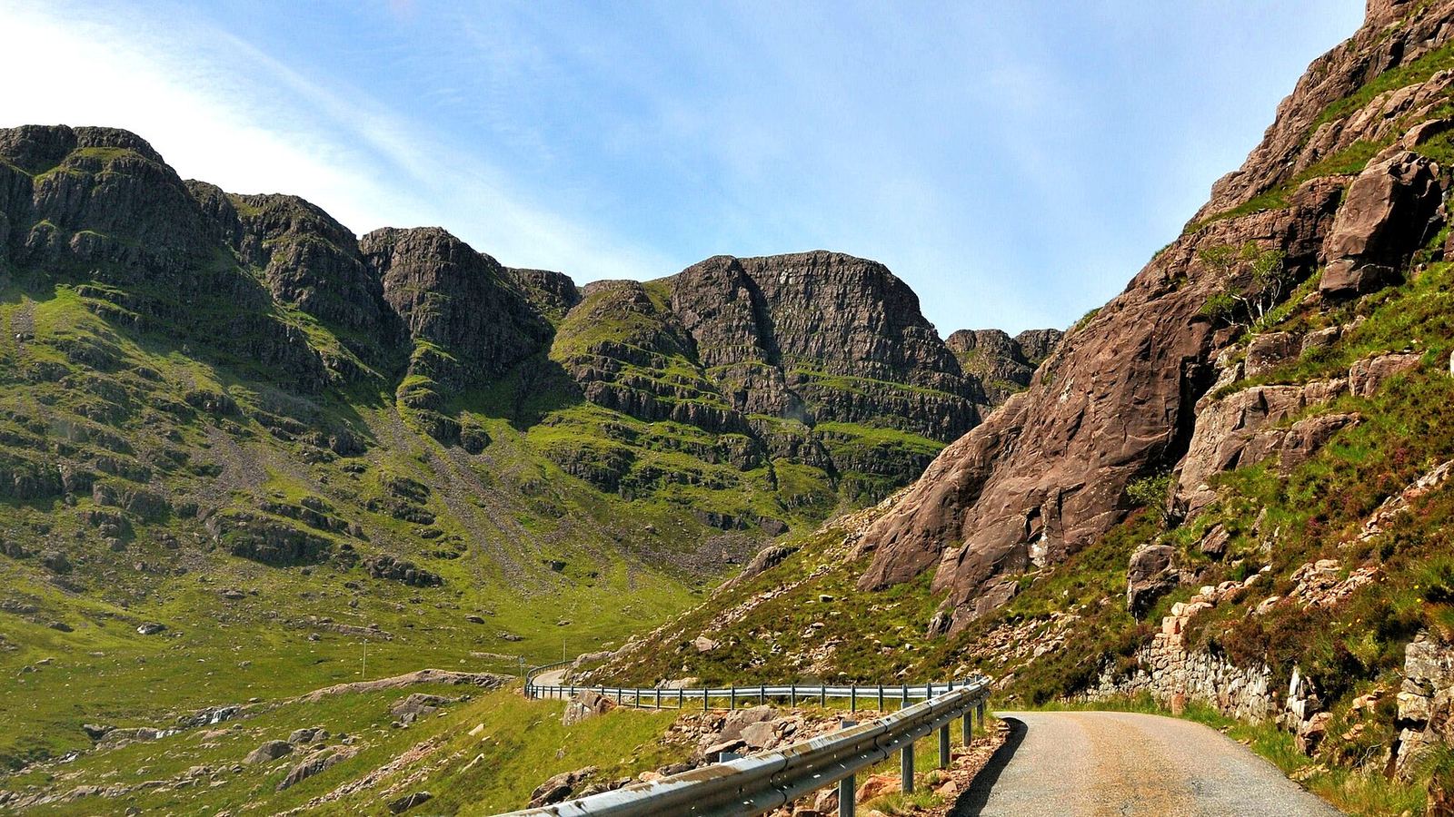 Single-track mountain road climbing the Bealach na Ba pass toward Applecross, Scottish Highlands, UK